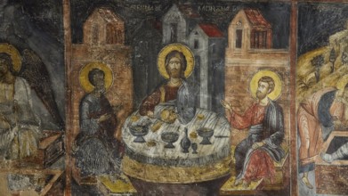 A fresco of the Last Supper with saints, dominating gold and brown tones, Easter 2025, Church of