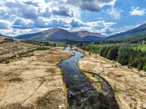 Mountains and Moors over Loch Tulla and River Orchy from a drone, Highlands, Scotland, UK