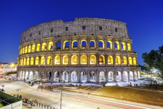 Colosseum ancient amphitheatre at night in Rome, Italy, Europe