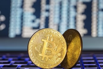 Symbolic bitcoins on a laptop