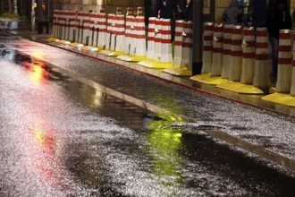 Security barrier for an event, large city at night, Germany, Europe