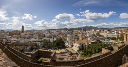 Panoramic view over the historic city of Malaga in Spain, under a clear blue sky with picturesque