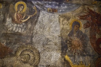 A fresco shows an angel and Mary under a starry sky with a dragon-like creature, Easter 2025,