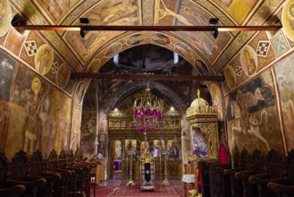 Ornamental church interior with frescoes and a magnificent iconostasis, monastery, Moni Thari, near