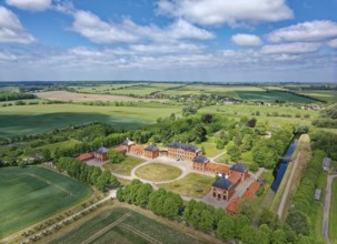 Aerial view of Bothmer Castle, a baroque three-winged complex. The castle stands on a rectangular