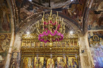 Magnificent interior of a church with golden details and frescoes, monastery, Moni Thari, near