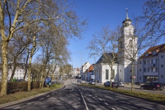 Friedenskirche Saarbrücken, bare trees, apartment buildings, street, blue sky, cloudless,