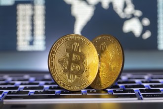 Symbolic bitcoins on a laptop