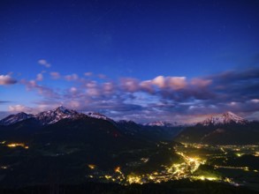 Starry sky at dawn over the valley basin of Berchtesgaden, behind Hoher Göll, Steinernes Meer and
