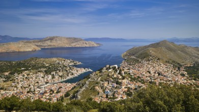 Wide island panorama with deep blue sea and sky, emphasises a peaceful atmosphere, Symi Town, Symi,