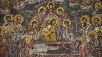 Fresco showing Christ with saints, many icons with golden decoration in an ornate frame, Easter