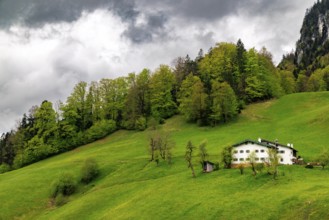 Old farmhouse in Maria Gern under dark clouds, Berchtesgaden, Berchtesgadener Land, Upper Bavaria,