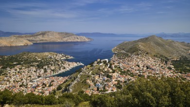 Panorama of an island with a wide sea view and blue sky, conveys peace and space, Symi Town, Symi,