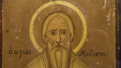 A portrait of a saint with a halo on an ancient icon, Thari Monastery, Moni Thari, near Gadouras