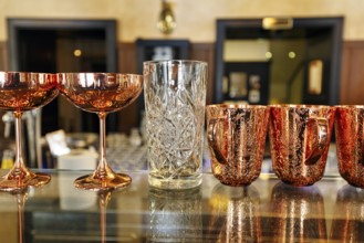 Various decorated glasses on a counter, classic coffee house, Central Grand Café, bar, Budapest,