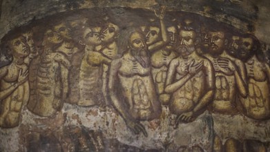 An oppressive scene in a fresco with skeletons and suffering figures in a cramped crowd situation,
