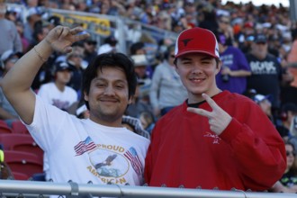 Fans cheer and watch the NASCAR Cup Series Championship Race at Phoenix Raceway in Avondale, AZ,