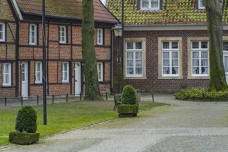 Small half-timbered town with brick houses and trees, quiet and charming atmosphere, billerbeck,
