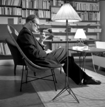 The designers of the Swedish String shelf. Nisse Strinning (1917-2006) pictured at home 1952.