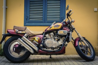 Honda Magna V45 motorcycle parked in front of a building