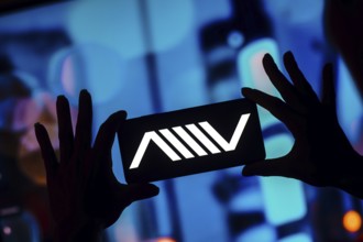 In this photo illustration, the Atlis Motor Vehicles (AMV) logo is displayed on a smartphone screen