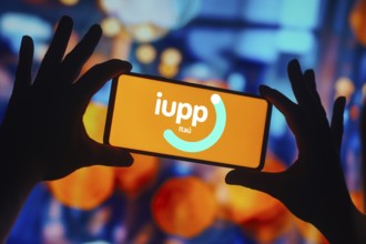 In this photo illustration, the Iupp Itaú logo is displayed on a smartphone screen