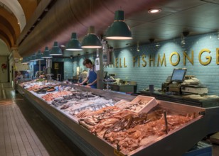 Cork, Ireland, 16 August, 2022: fishmonger market stall with fresh fish and seafood on ice inside