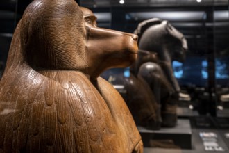 Figure of a squatting baboon, red quartzite, 18th dynasty reigning Amenhotep III, collection of the