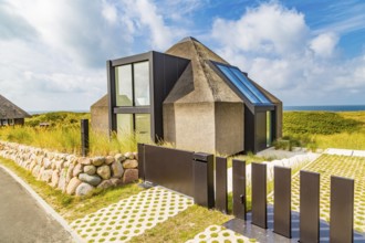 Controversial modern thatched-roof villa of the Kersig estate in the dunes, Hörnum, Sylt