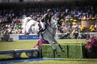Donald Whitaker of Great Britain and riding Millfield Colette compete in the first round of the 1