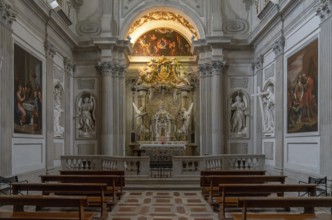 Spoleto, Italy, 25 November, 2022: altar and pews with statues and paintings inside the Spoleto