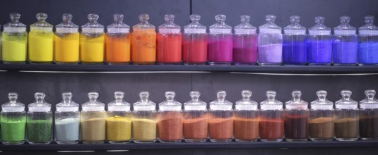 Glass containers with coloured powder at Creativeworld Frankfurt