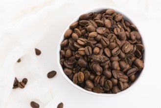 Bowl of caffee beans on a white background
