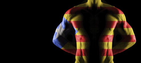 Catalonia flag on muscled male torso with abs, black background