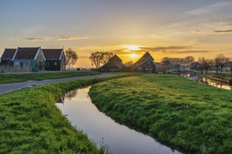 Sunrise at Zaanse Schans village with Dutch traditional house near Amsterdam Netherlands