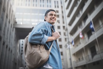 Background on the street while waiting his colleagues. Businessman wearing casual white shirt and