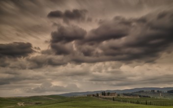 Vineyards in Tuscany under a dramatic cloudy sky