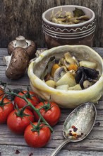 Vegetable hot plate made of baked dough cooked in a rustic style.Photo tinted