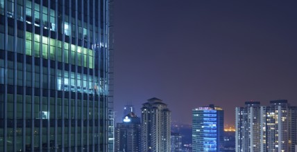 Modern business skyscrapers and high-rise buildings, commercial center. night scene