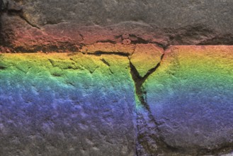 Refraction of colours on a stone - background and text space