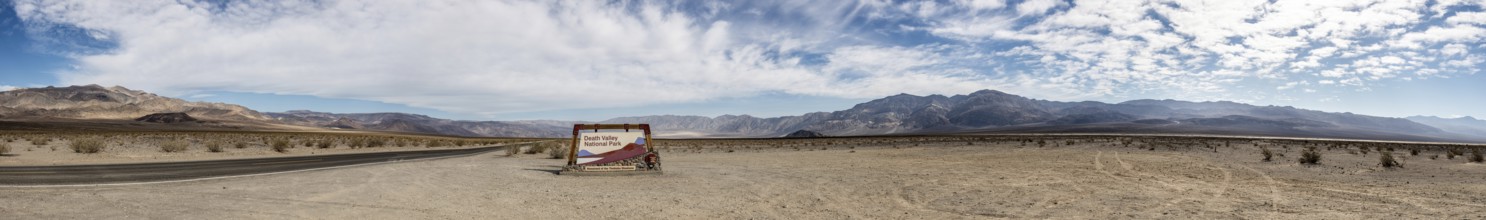 Panorama of Death Valley NP Sign with cloudy sky