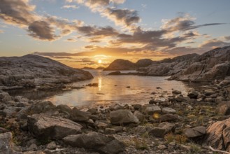 Golden sunset over a small bay