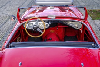 Lisbon, Portugal, Jan 20, 2024: Original red interior of red Austin-Healey 100 vintage convertible