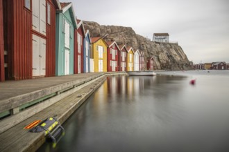 Small colourful houses by the sea. Typical houses in Sweden for the coastal landscape. Crab fishing