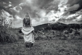 Mountain landscape with woman's silhouette after the storm