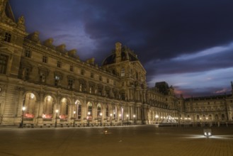 PARIS, FRANCE, MAY 13, 2022, The famous Parisian Louvre Palace at dawn, France, Europe