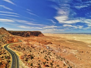 Beautiful road over the mountains of the national park, aerial view from a drone