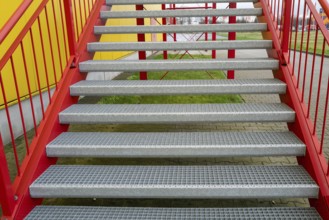 Red metal stairway at factory