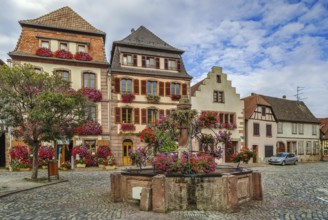 Square with fountain in Bergheim, Alsace, France, Europe