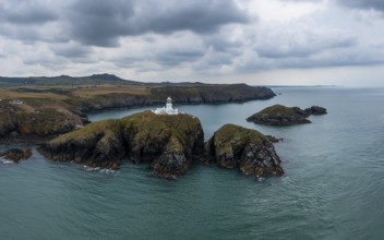 Aerial landscape view of the Pembrokeshire coast with the historic Strumble Head Lighthouse